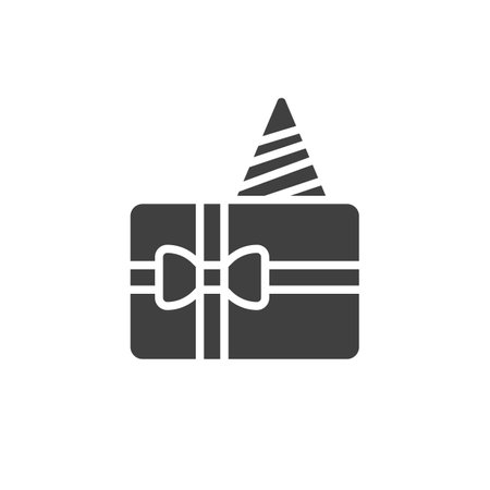 Gift box with a birthday hat vector icon. filled flat sign for mobile concept and web design. Birthday Gift Box glyph icon. Surprise symbol, logo illustration. Vector graphicsのイラスト素材