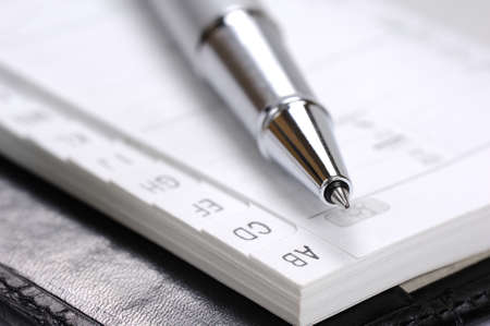 Alphabetical index in the phone book and ballpen