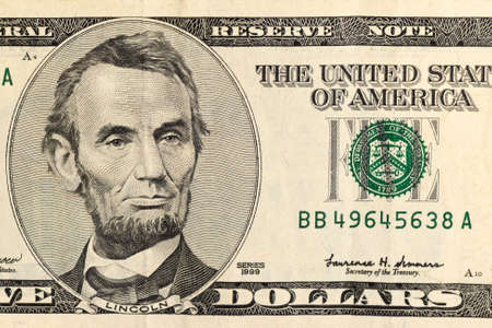 Lincoln on five-dollar bill closeup