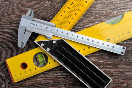 Sliding caliper, setsquare and bubble level