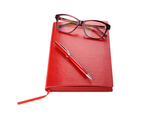 Daily planner with eyeglasses and pen red colorの写真素材
