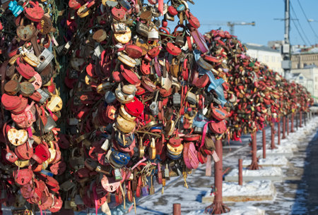 Avenue of Bridal trees from metal with closed locks of love on Bolotnaya embankmentのeditorial素材