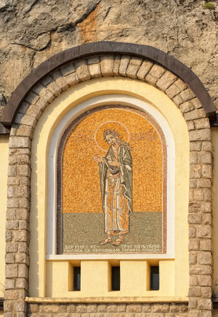 Montenegro, Danilovgrad - August 10, 2017: Mosaic icon on the facade of male Ostrog monastery, landmarkのeditorial素材