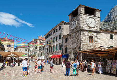 Montenegro, Kotor - August 13, 2017: Old Town, Arms Square, tourists near the Clock Tower built in 1602, landmarkのeditorial素材