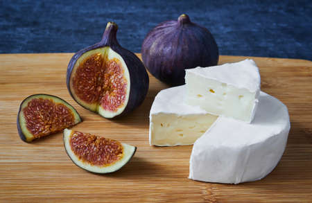 Slices of cheese Bree and figs, close upの写真素材