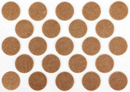 Felt sticky pads for furniture legs, circular brown on white plastic card, for use in office or...