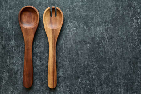 Kitchen utensils, wooden salad spoons in vintage style. Top view with copy placeの写真素材
