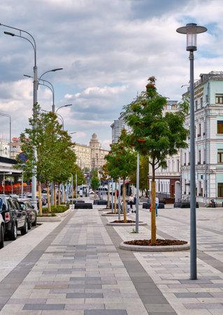 Pedestrian zone, sidewalk laid with stone tiles along Sadovaya-Samotechnaya street, with benches for rest, cityscape: Moscow, Russia - September 13, 2021のeditorial素材