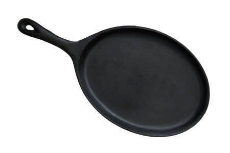 Oval cast iron pan for frying and serving dishes isolated on white backgroundの写真素材