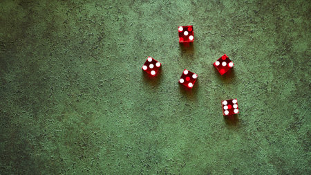 Red casino dice top view on green textured background, the concept of gambling