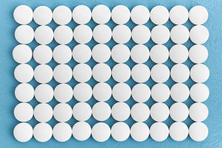Rows white medical pills on blue background, pharmaceuticals, medical, and chemistry
