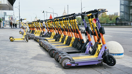 Parking and rental of electric kickboards in the city, an eco-friendly transport concept: Moscow, Russia - May 11, 2022のeditorial素材