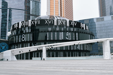Moscow City Business Center, view of a modern concert hall built in the shape of a clock on the city square, landmark: Moscow, Russia - May 11, 2022のeditorial素材