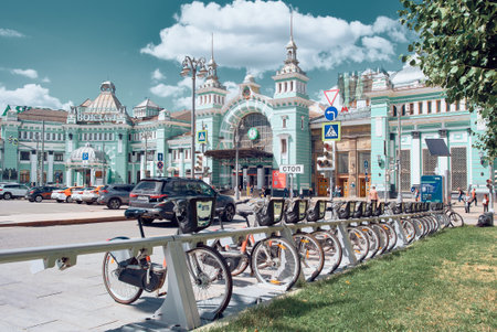 A row of parked rental bikes on Tverskaya Zastava Square in front of Belorussky Railway Station: Moscow, Russia - July 22, 2022のeditorial素材