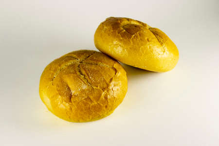 Buns on a white background. Close up. Fresh homemade bread on white background.