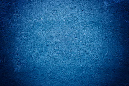 Texture of concrete and plaster on the wall. Blue Creative Tinting. Drips on the wall close-up. Wavy...