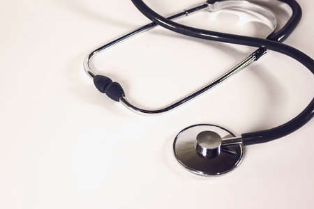 Medical stethoscope on white background with copy space for your text. Health care concept. Healthcare and medical equipment. Medical check-up and diagnosing. Doctors' dutiesの写真素材