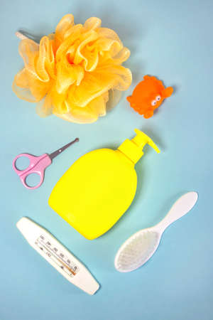 Children's hygiene: bath items, shampoo bottle, rubber toy, sponge, comb, thermometer, safety...
