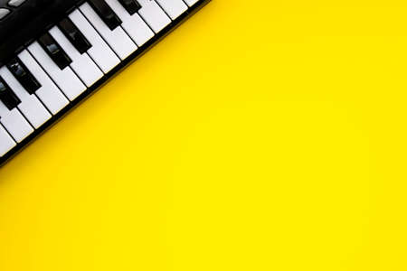 Music Keyboard over yellow background. Copy spaceの写真素材