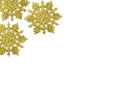 Golden snowflake ornament. Christmas background with gold snowflakes on whiteの写真素材