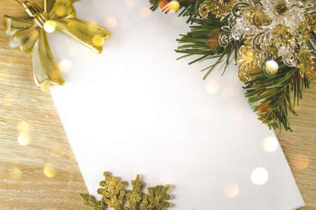 Christmas 2021 decoration frame of fir branches, gold toys and snowflakes. Letter to Santa Claus. A New Year's background with New Year decorationsの写真素材