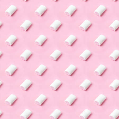 Seamless pattern white-pink marshmallows placing on pink flatlay. Marshmallow pastel colors on pink backgroundの写真素材