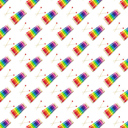 Seamless pattern of Rainbow Colored Wooden Toy 8 tone Xylophone glockenspiel isolated on white...