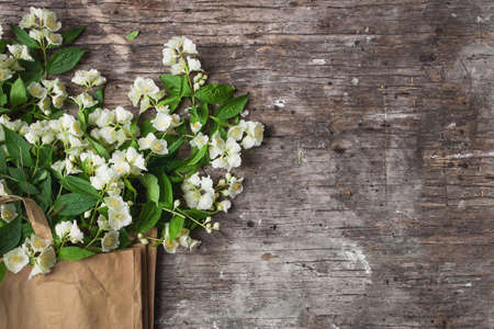 Flowers composition for Valentine's, Mother's or Women's Day. Jasmine Spring Flowers On old wooden...