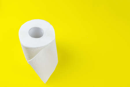 Top view of white toilet paper rolls on red background with copy spaceの写真素材