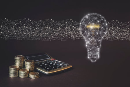 Coins Stack and calculator and virtual gologram of light bulp. Concept of money business bright idea of Savings money and income Investment ideasの写真素材