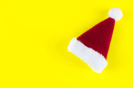 Santa's Red Cap on yellow background. Close upの写真素材