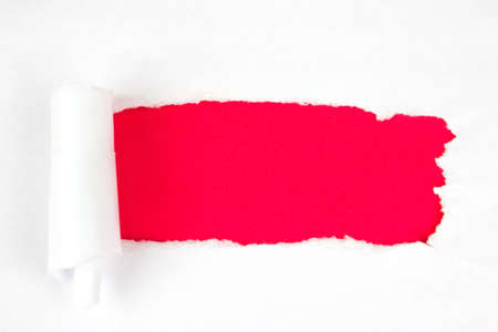 Red Hole in the white paper with torn sides, copy space.の写真素材