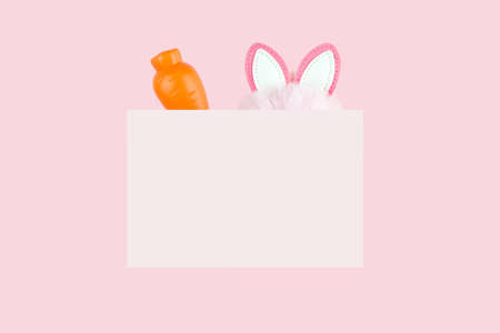 Emblem with carrot and hare ears on pink. Spring holiday design