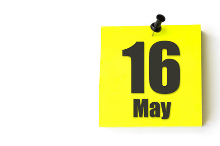 May 16th. Day 16 of month, Calendar date. Yellow sheet of the calendar. Spring month, day of the year conceptの写真素材