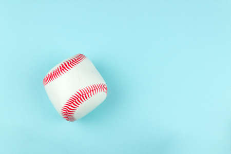 Small white red ball for baseball sport game on blue backgroundの写真素材