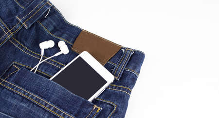 Mobile phone with headphone in your back pocket jeansの写真素材