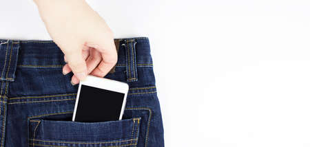 Woman Removing Blank Mobile Phone From Pocket