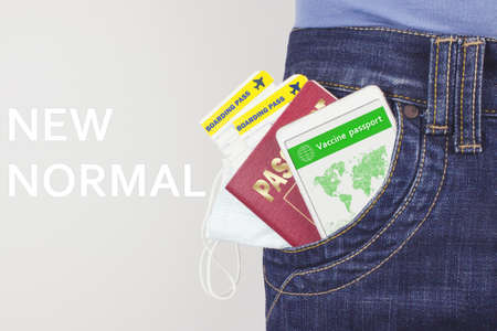 Vaccination passport on a mobile phone In Your Pocket Jeans. Vaccination, disease immunity passport, health. NEW NORMAL conceptの写真素材