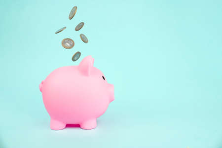 Money saving for future investment and retirement concept. concept theme with a pink piggy bank with...