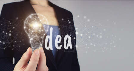 Idea of learning online. Network bright idea with light bulb. Hand hold digital light bulp with text...