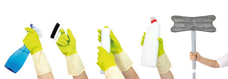 Top view of hand in yellow rubber gloves holding cleaning supplies collection isolated on white...