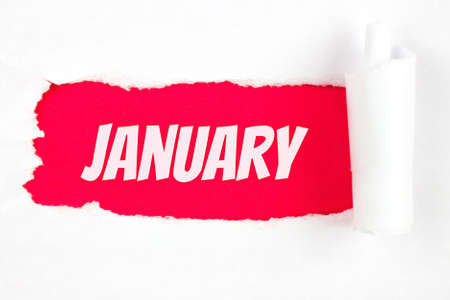 January. Month, Calendar month. Red Hole in the white paper with torn sides with calendar month. Winter, month of the year conceptの写真素材