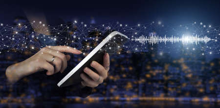 Audiobook audio technology. Digital sound track on hand. Hand touch white tablet with digital...
