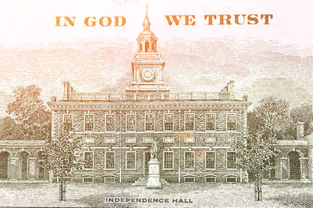 Independence Hall on the back side 100 dollars banknote. Hundred dollars bill fragment on macro