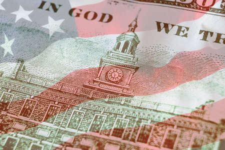 Independence Hall on back side 100 dollars banknote with american flag background. 100. Economy,...