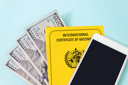 Fake International vaccination certificate   with empty mock up screen smart phone for QR code of an Unvaccinated person of an Illegal virus ID card. Buying fake certificatesの写真素材
