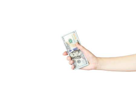 Close-Up Of Hand Holding Paper Currency Against White Background