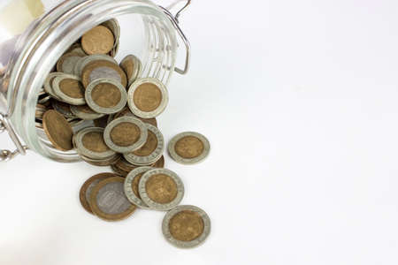 Gold money coin background in jar, concept saving money.の写真素材