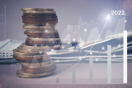 Coins stacked on each other in different positions. Concept of corporate business economy and...