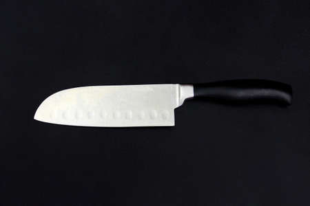 Sharp chef knife on black, high quality stainless steel, plastic handleの写真素材